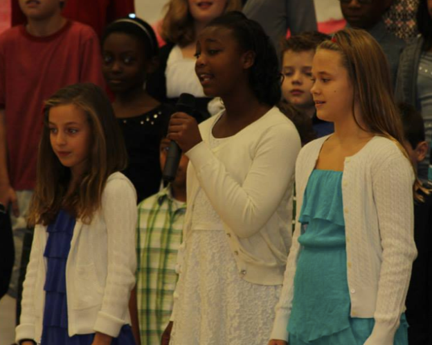 Mia, Haleigh and Hanna sang the solo at the beginning of our song.