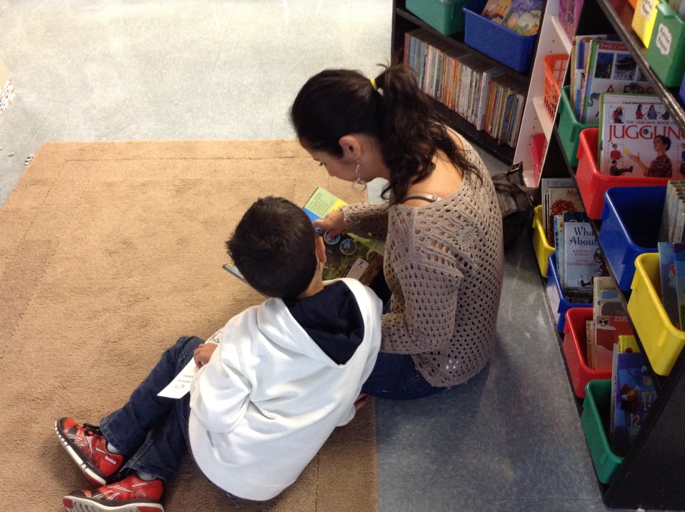 Diego and his mom enjoy a story together!